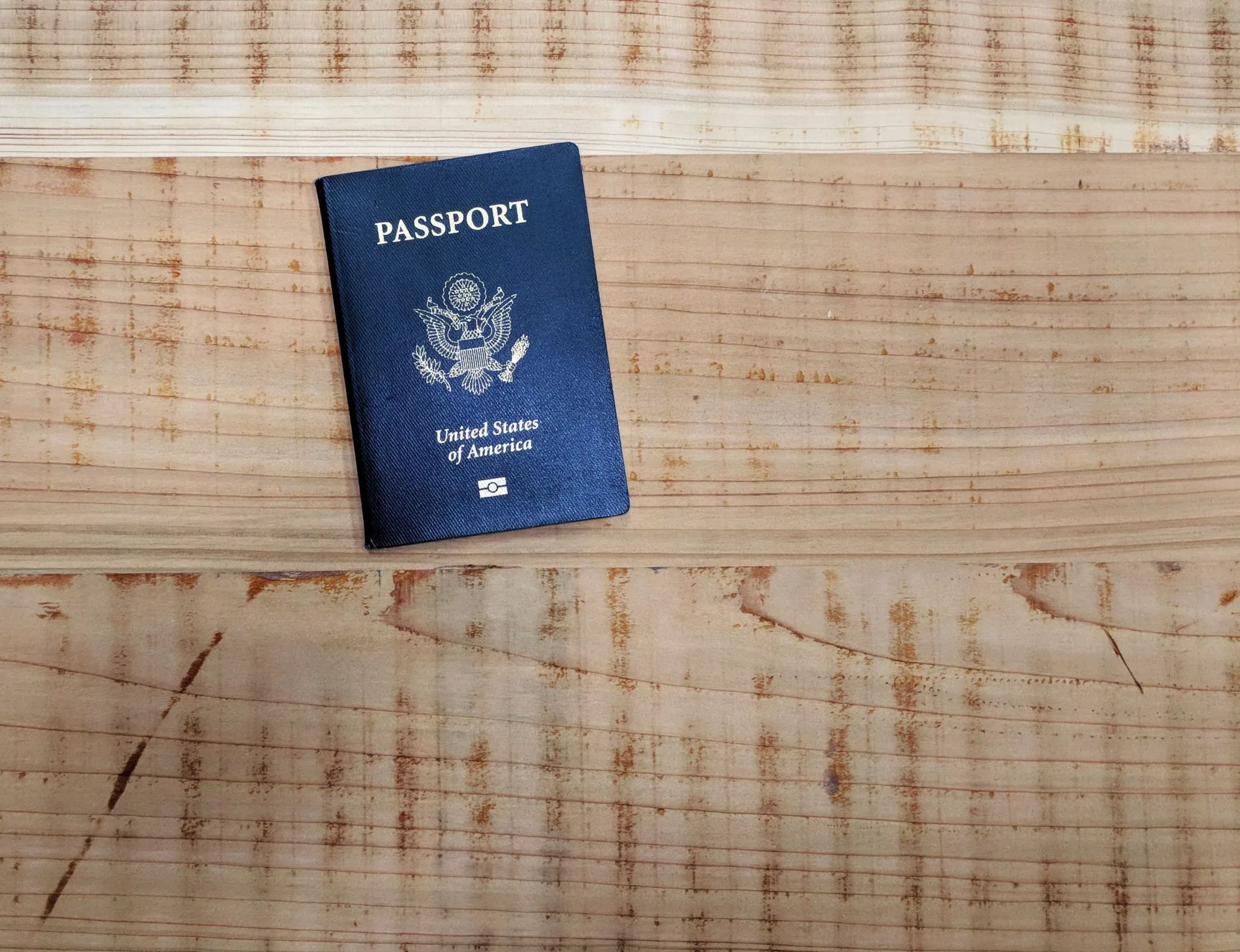 US Passport on wooden table