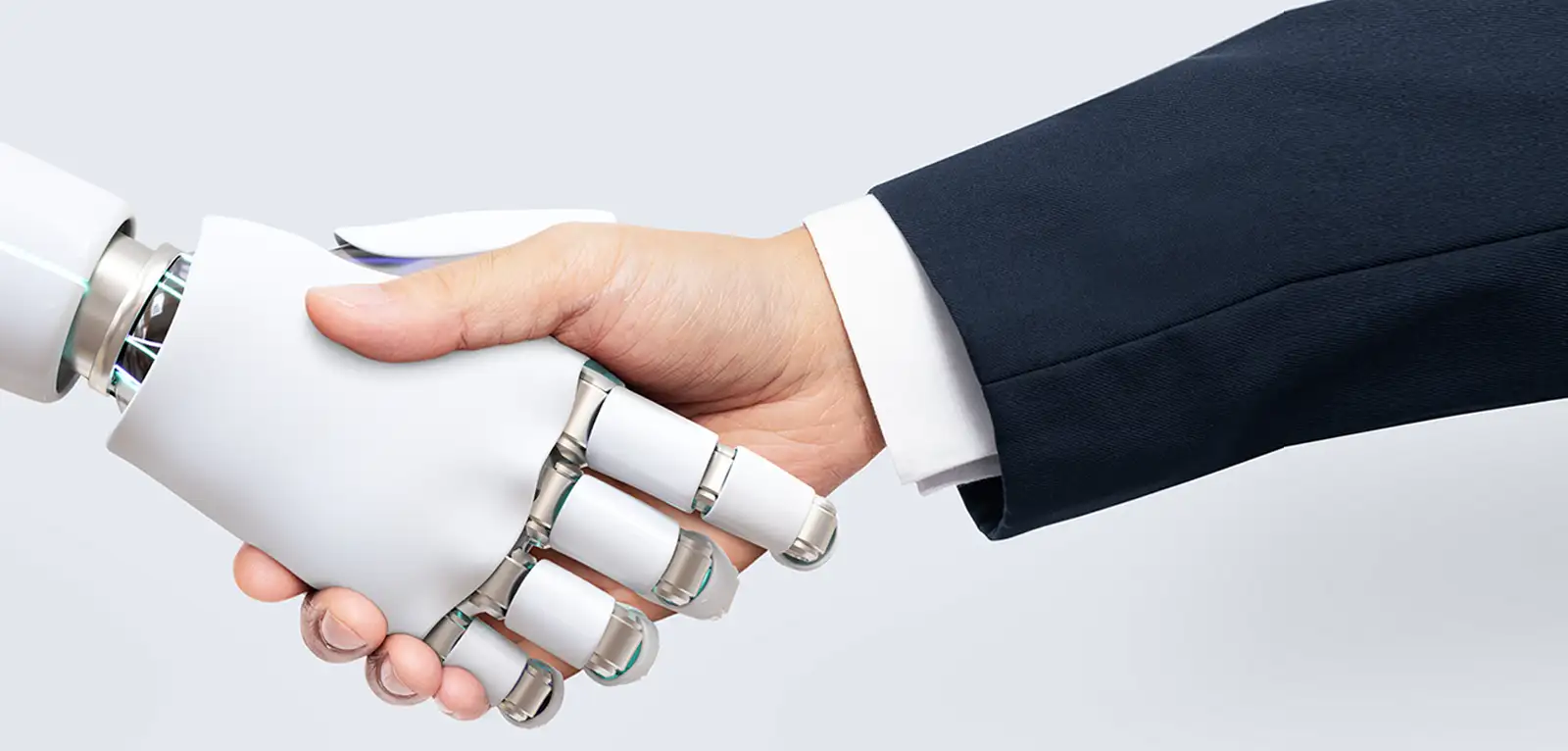 Robotic hand shaking a human hand